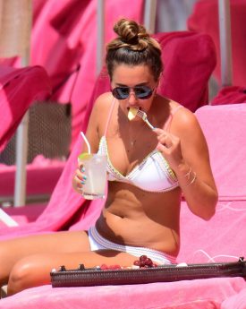 Georgina leigh cantwell having food at beach in barbados