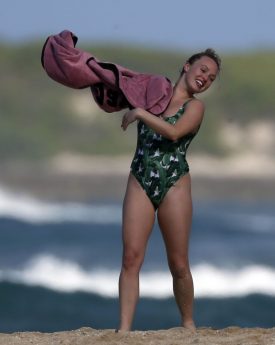 Sexy jorgie porter in a green patterned swimsuit at beach of hawaii