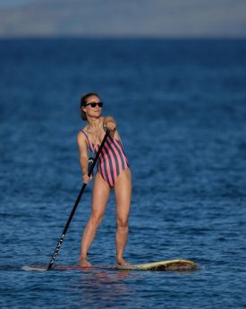 Olivia wilde in swimsuit paddleboarding at hawaii